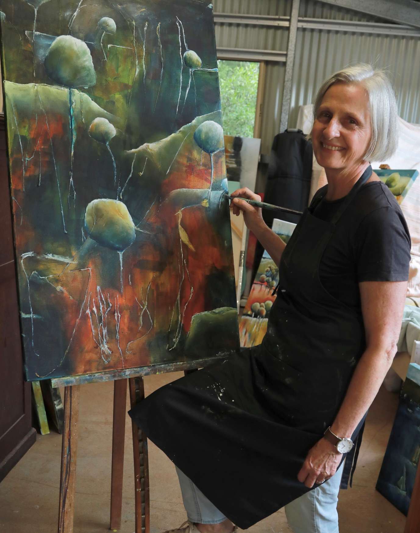 Jen Foxton at her easel in her Highfields studio.